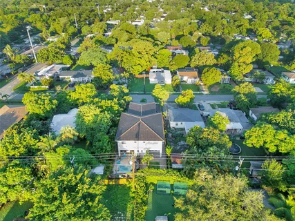 a view of a backyard with a tree