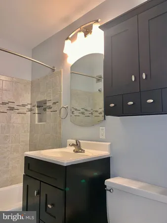 a bathroom with a shower and a bathtub