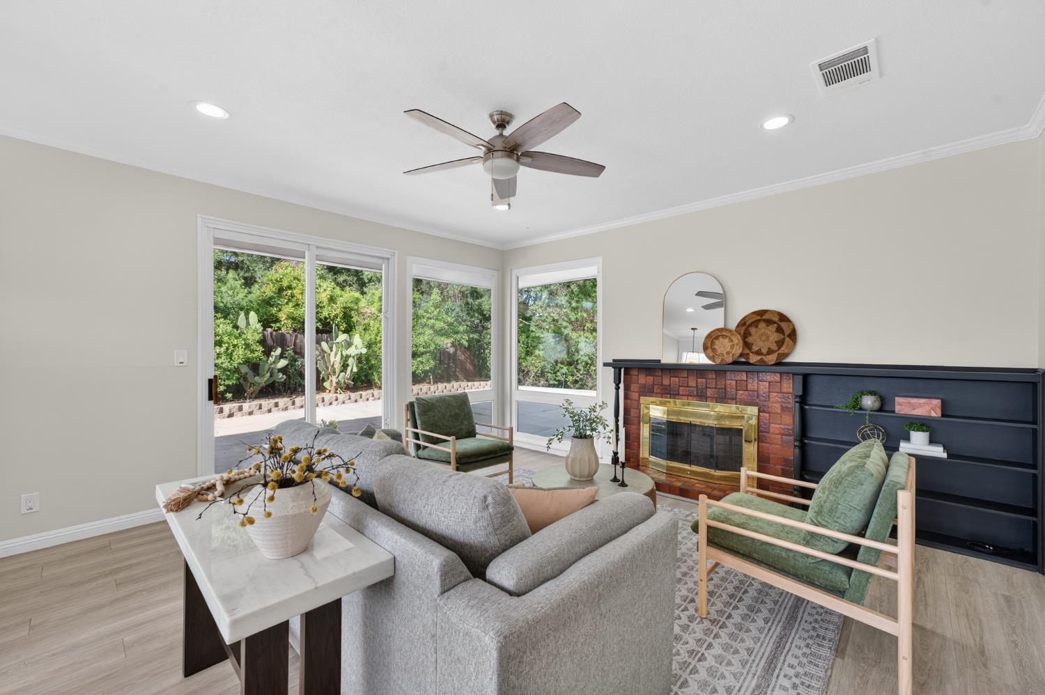 6035 Bryce Way Rocklin, CA 95677 - Photo 11 of 39 a living room with furniture and a fireplace