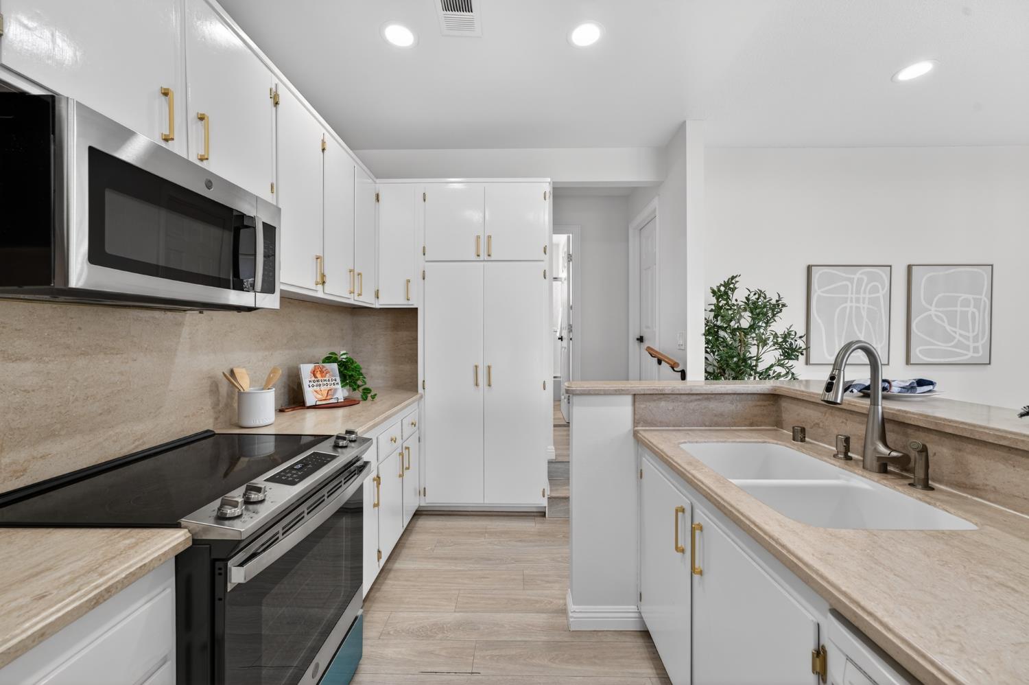 6035 Bryce Way Rocklin, CA 95677 - Photo 13 of 39 a kitchen with stainless steel appliances granite countertop a sink stove and refrigerator