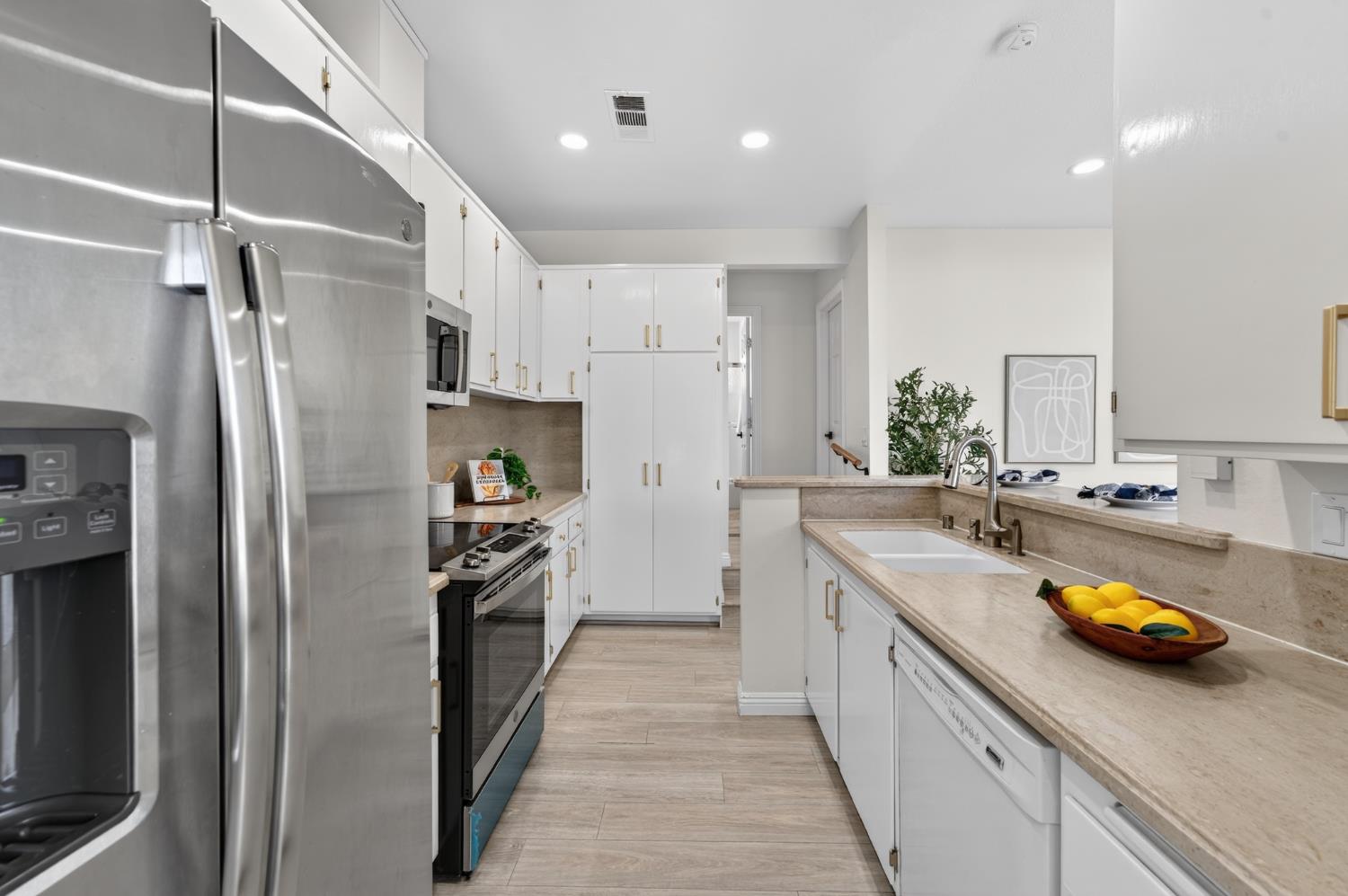 6035 Bryce Way Rocklin, CA 95677 - Photo 14 of 39 a kitchen with a sink and stainless steel appliances