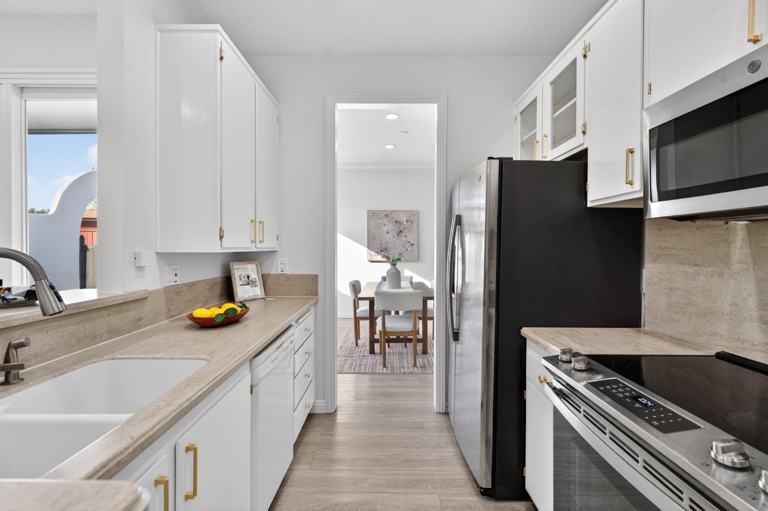 6035 Bryce Way Rocklin, CA 95677 - Photo 15 of 39 a kitchen with a refrigerator and a sink