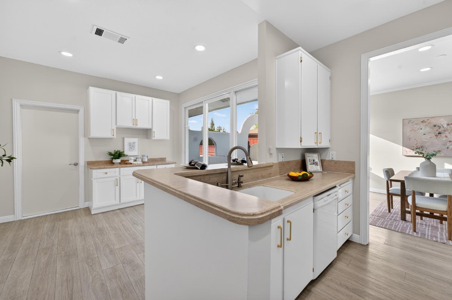 6035 Bryce Way Rocklin, CA 95677 - Photo 16 of 39 a kitchen with a sink stove and cabinets