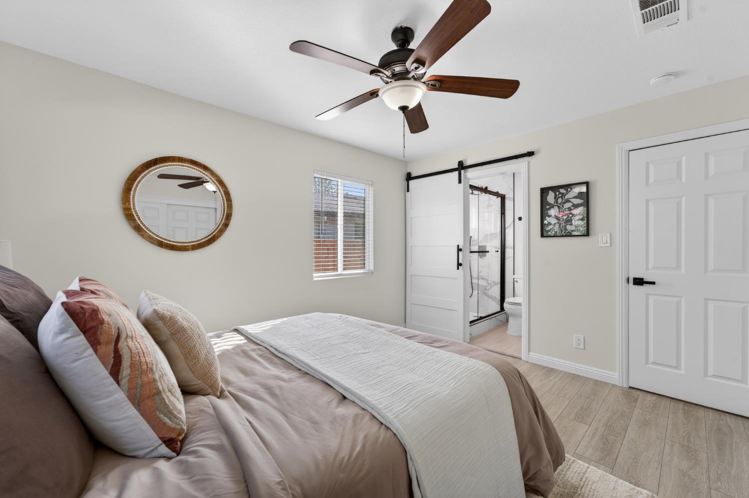 6035 Bryce Way Rocklin, CA 95677 - Photo 24 of 39 a bedroom with a bed and a chandelier