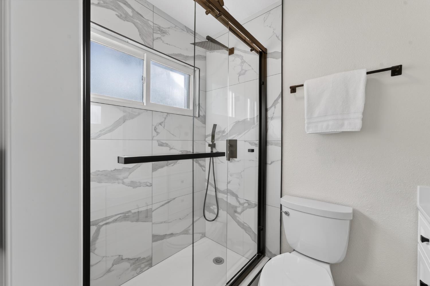 6035 Bryce Way Rocklin, CA 95677 - Photo 28 of 39 a bathroom with a shower and toilet