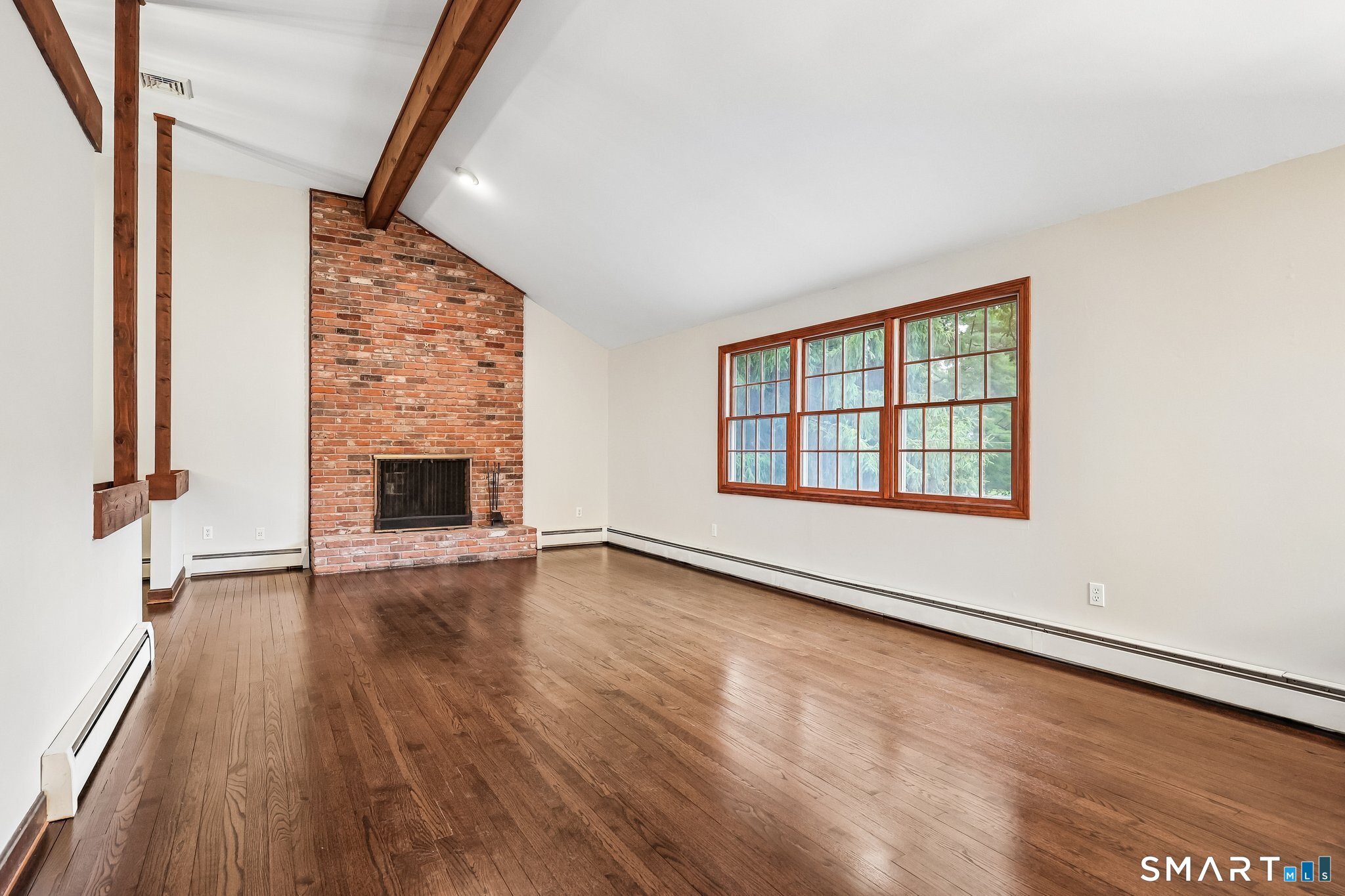 81 Crescent Road Glastonbury, CT 06033 - Photo 3 of 38 Vaulted ceiling, gleaming hardwood floors, floor to ceiling brick fireplace