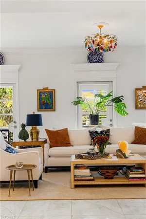 a living room with a couch and a large window