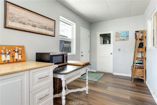 a room with furniture and wooden floor