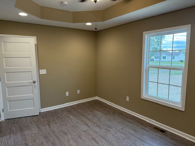 1427 Old Estill Springs Road Tullahoma, TN 37388 - Photo 24 of 44 an empty room with wooden floor and windows