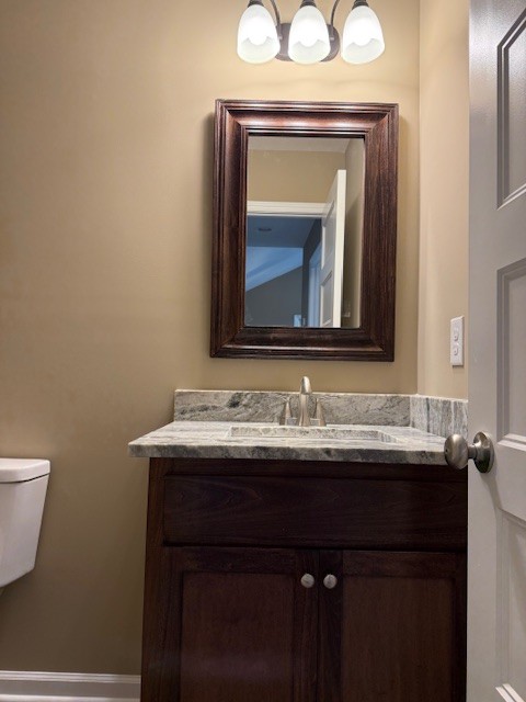 1427 Old Estill Springs Road Tullahoma, TN 37388 - Photo 27 of 44 a bathroom with a toilet sink and mirror