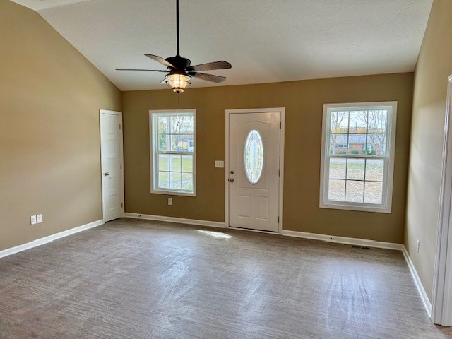 1427 Old Estill Springs Road Tullahoma, TN 37388 - Photo 30 of 44 an empty room with wooden floor windows and fan