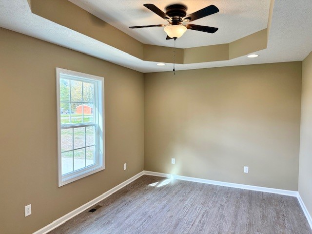 1427 Old Estill Springs Road Tullahoma, TN 37388 - Photo 33 of 44 a view of an empty room with a window and wooden floor