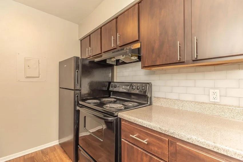 6897 Meadow Road North Richland Hills, TX 76182 - Photo 3 of 13 a kitchen with stainless steel appliances granite countertop a sink stove and refrigerator