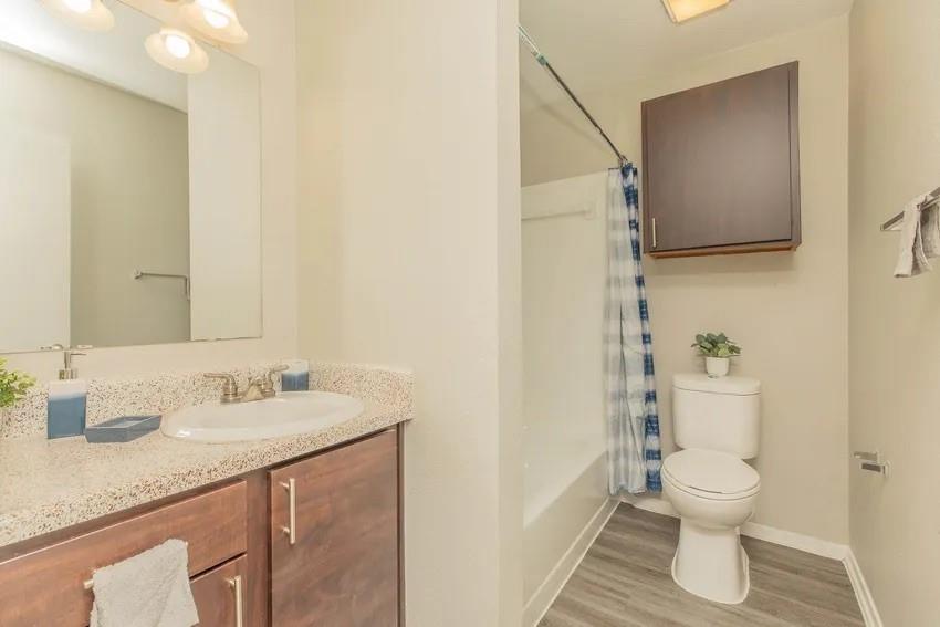 6897 Meadow Road North Richland Hills, TX 76182 - Photo 5 of 13 a bathroom with a granite countertop sink toilet and shower