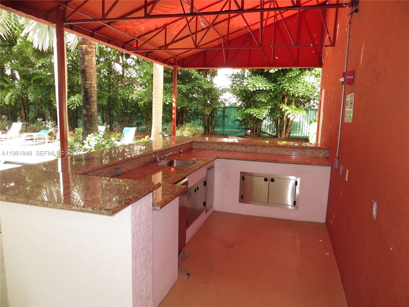 133 Northeast 2nd Avenue, Unit 308 Miami, FL 33132 - Photo 24 of 25 a kitchen view with a sink and yard