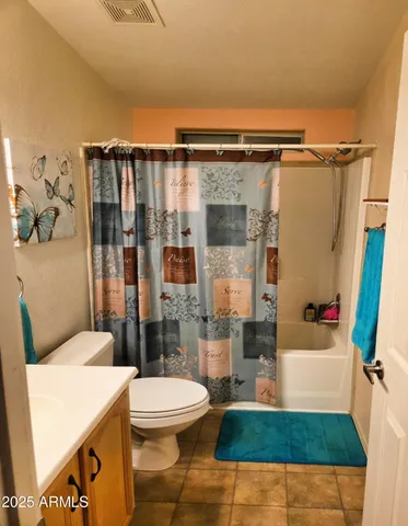 a front view of house along with trees