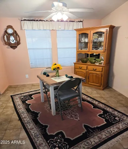 a room with table chairs and a stove