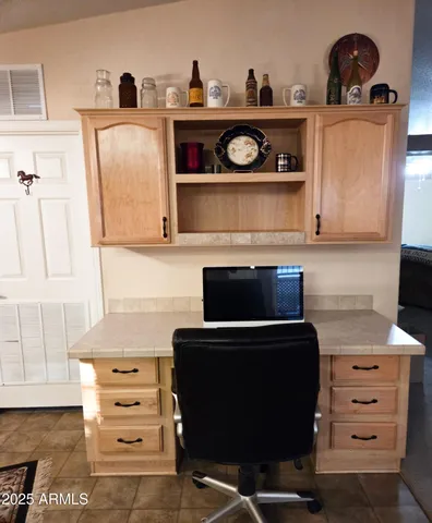 a view of kitchen appliances and wooden floor