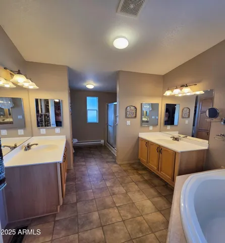 a large room with lots of counter space and windows