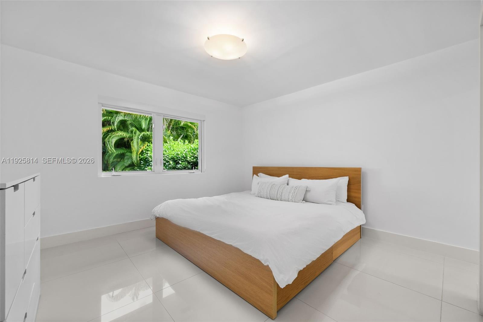 45 Southwest 19th Road Miami, FL 33129 - Photo 27 of 56 a bedroom with a bed and a window