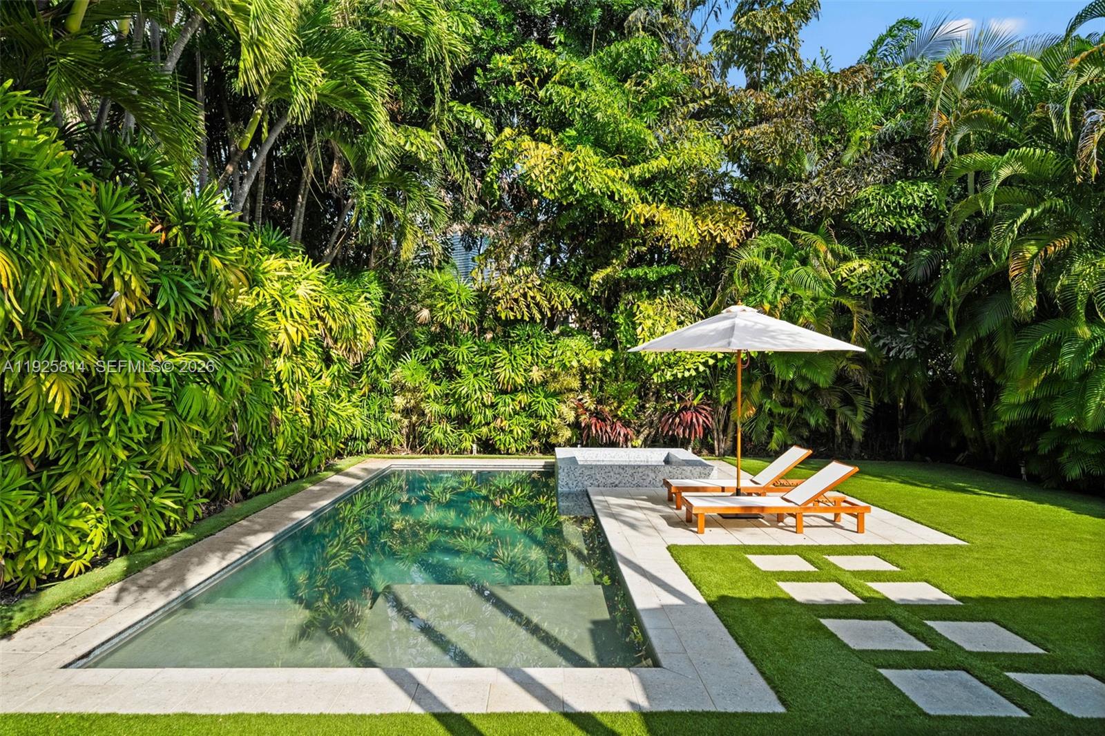 45 Southwest 19th Road Miami, FL 33129 - Photo 32 of 56 a view of swimming pool with lounge chair