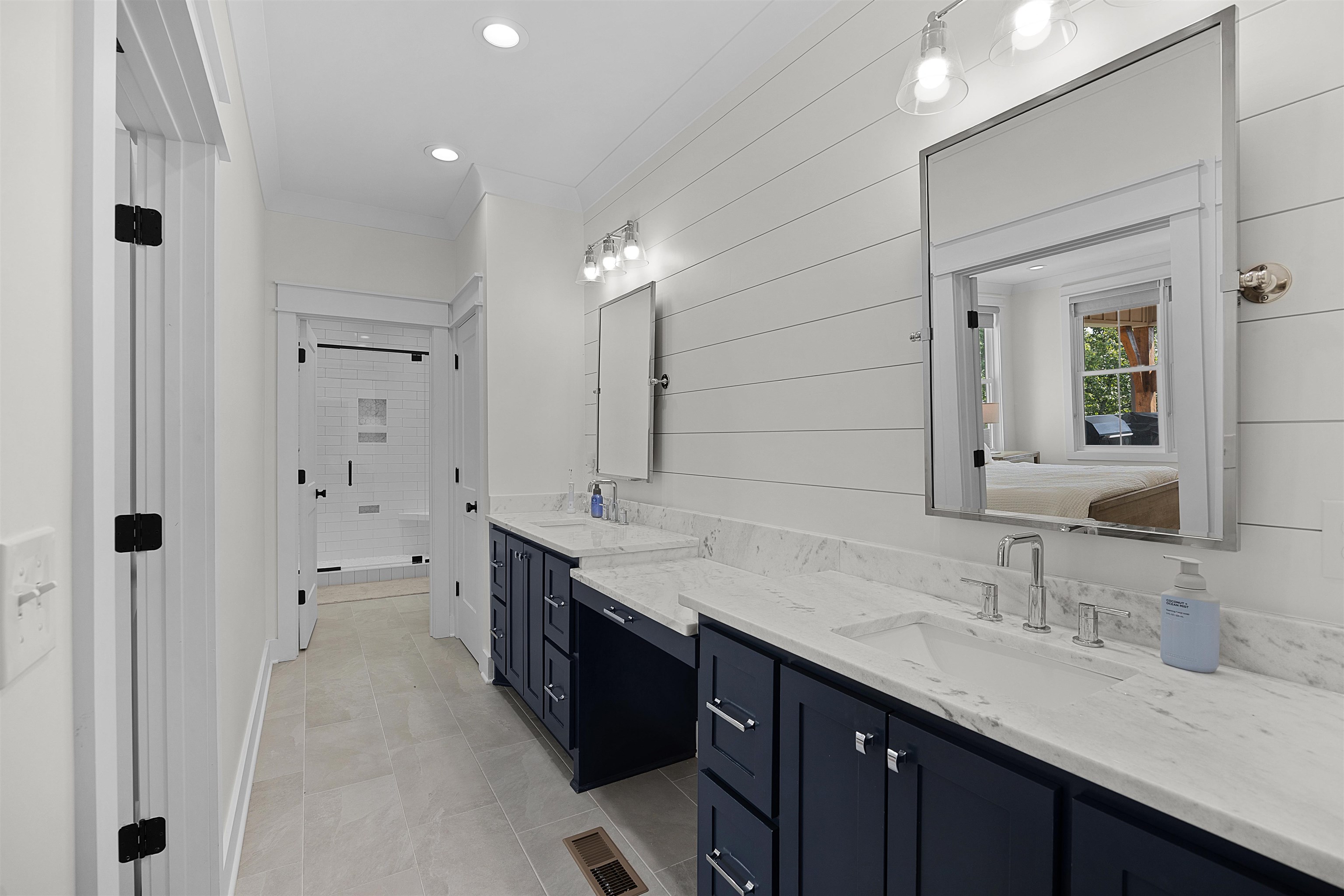 15 Daylight Cove Savannah, TN 38372 - Photo 13 of 37 a bathroom with a granite countertop sink two mirror and shower