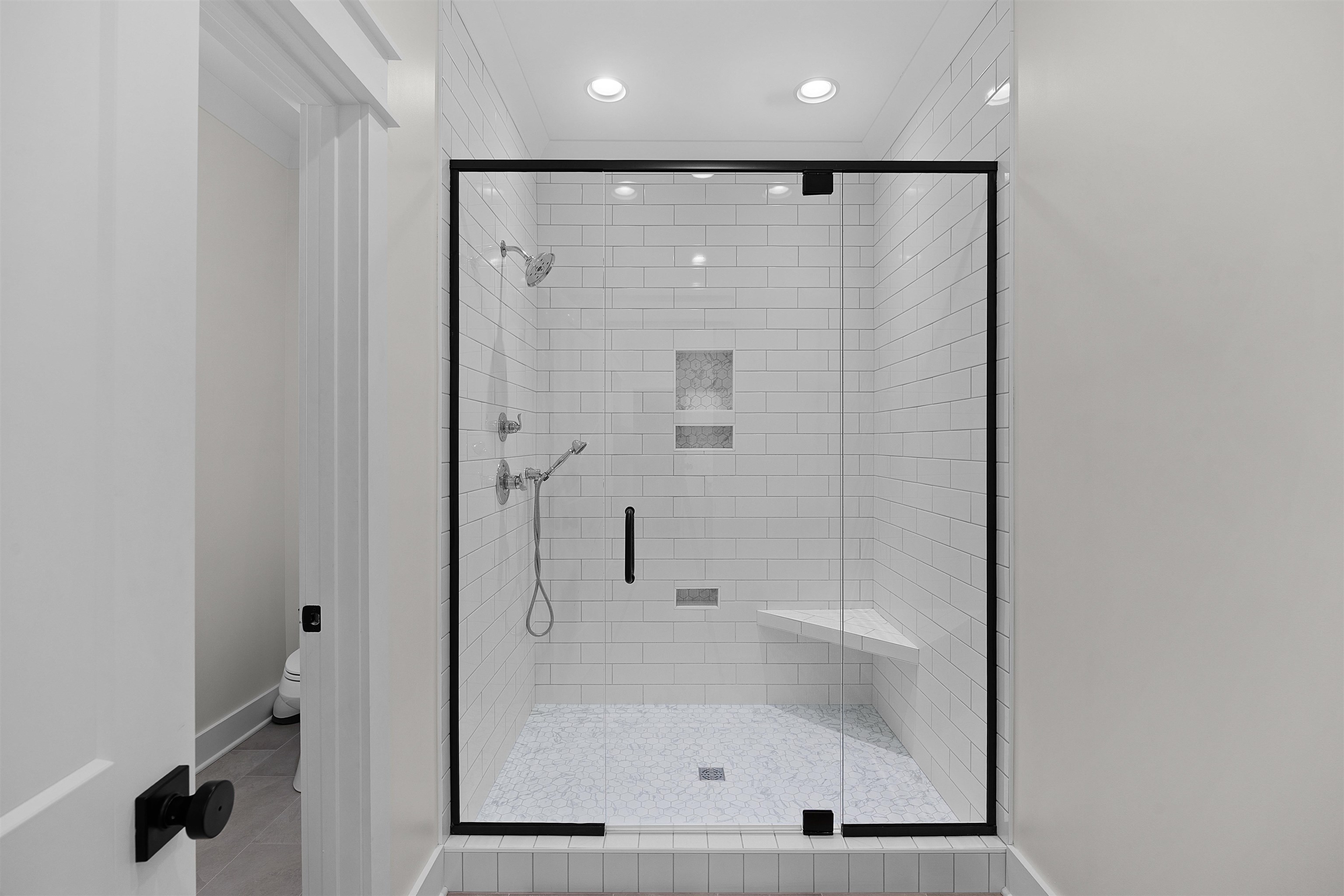 15 Daylight Cove Savannah, TN 38372 - Photo 14 of 37 a bathroom with a glass shower door