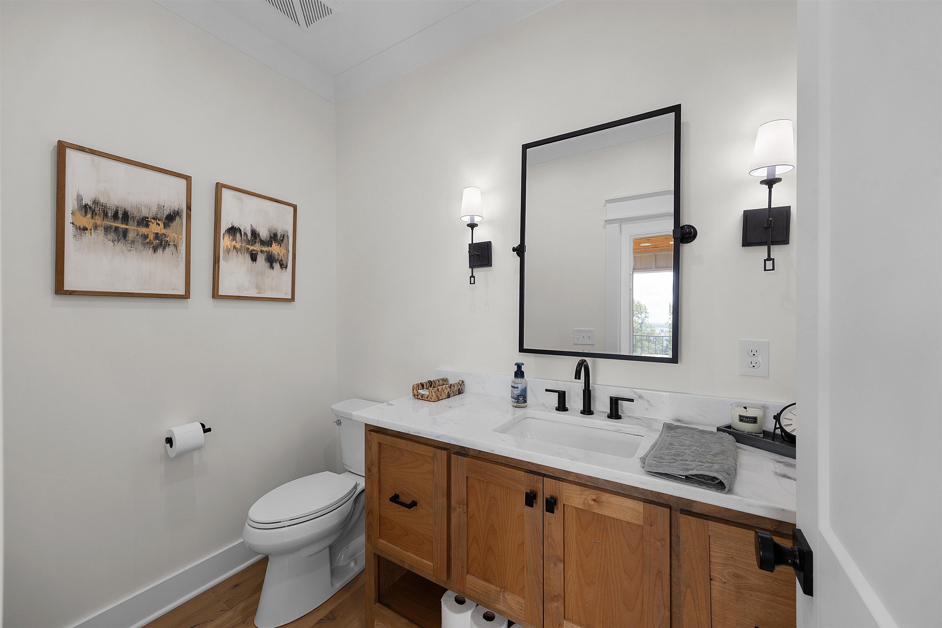 15 Daylight Cove Savannah, TN 38372 - Photo 15 of 37 a bathroom with a granite countertop sink mirror vanity and toilet