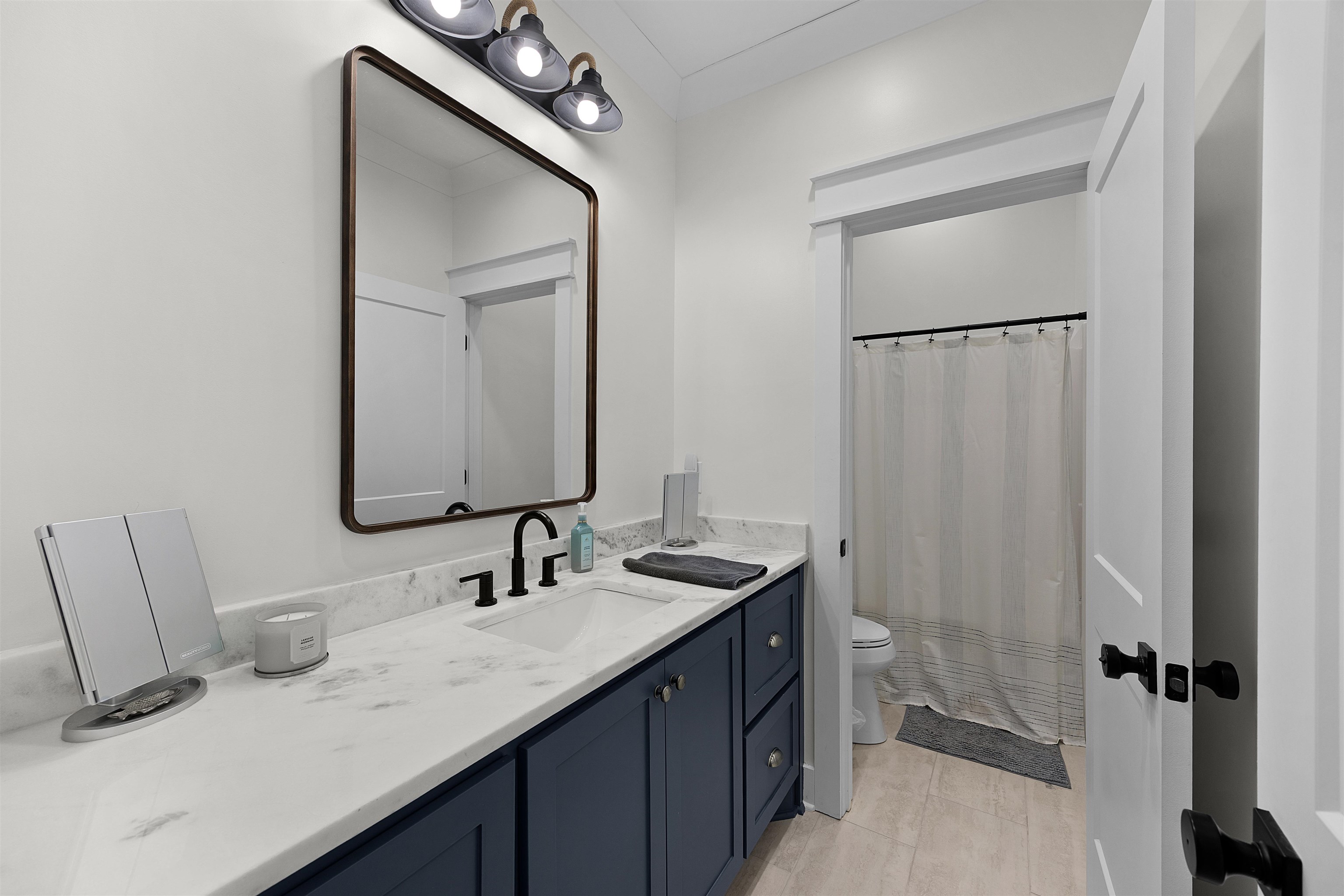 15 Daylight Cove Savannah, TN 38372 - Photo 19 of 37 a bathroom with a sink vanity granite and a mirror