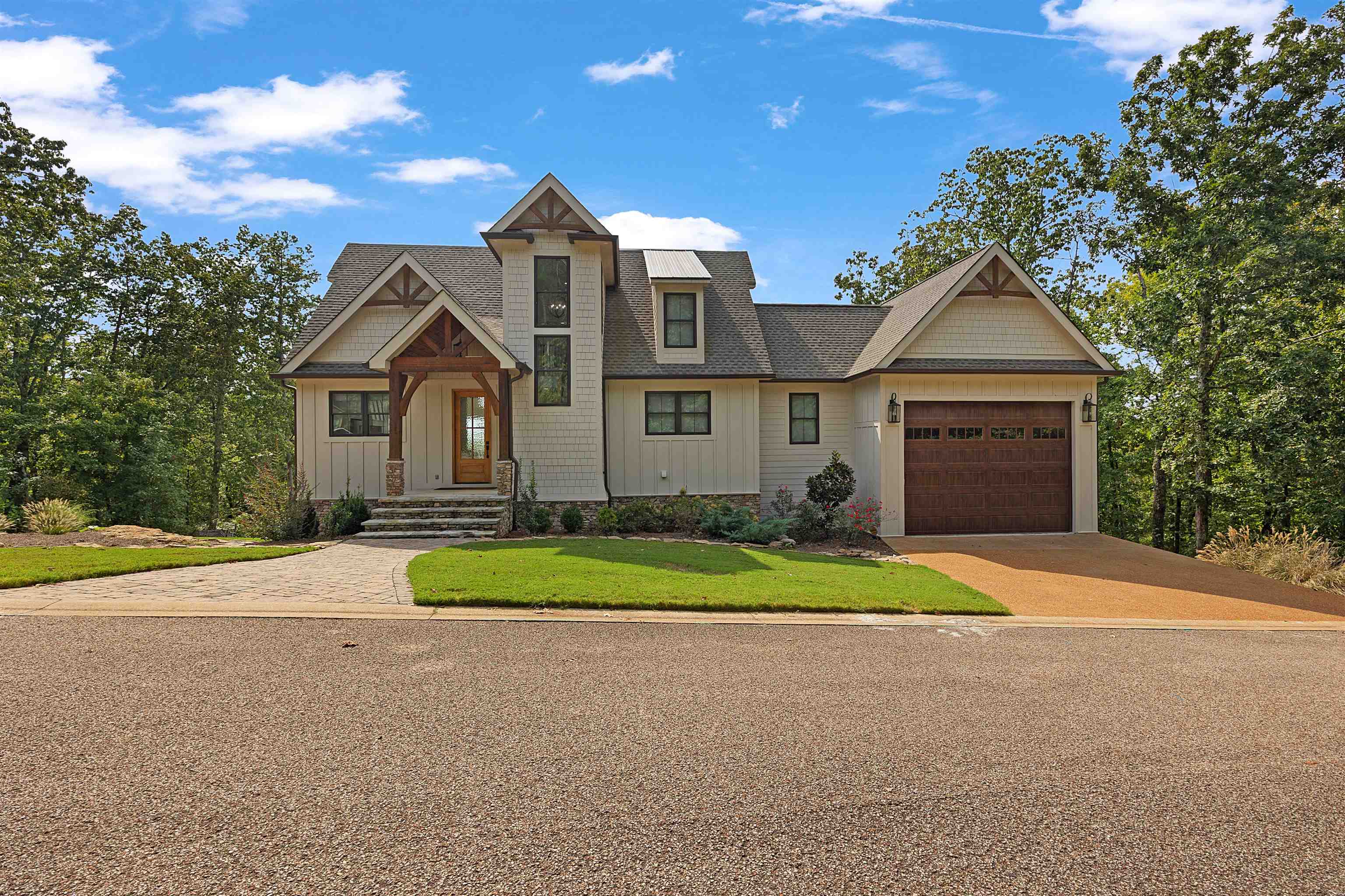 15 Daylight Cove Savannah, TN 38372 - Photo 2 of 37 a front view of a house with a yard and garage