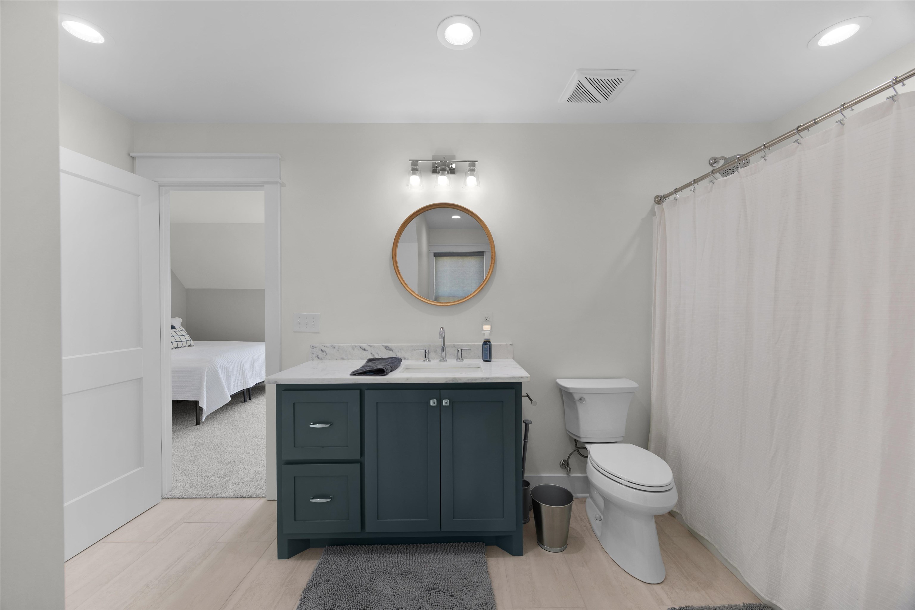 15 Daylight Cove Savannah, TN 38372 - Photo 24 of 37 a bathroom with a toilet sink and mirror