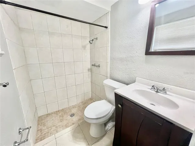 a view of a room with cabinet and mirrors