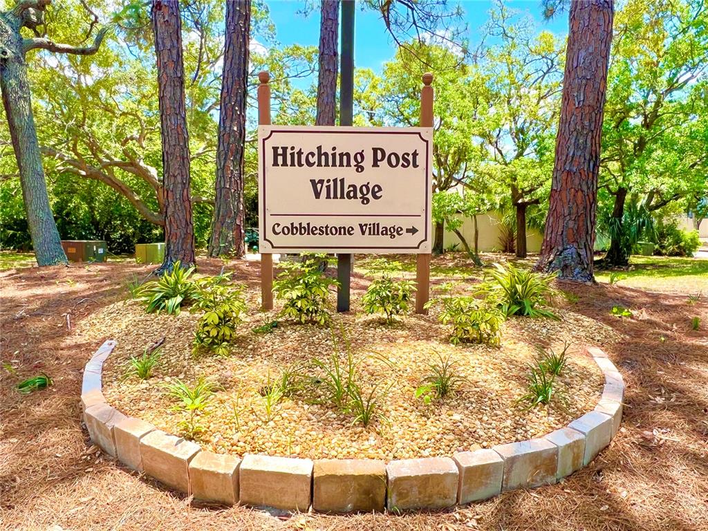 12206 Quail Run Row Hudson, FL 34667 - Photo 20 of 20 a sign on the side of the road