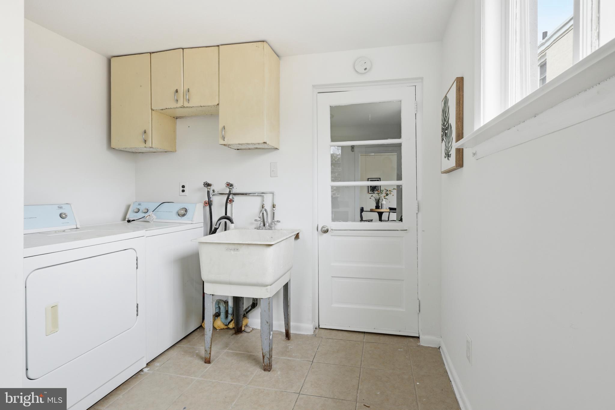 116 West Duval Street Philadelphia, PA 19144 - Photo 12 of 28 a utility room with cabinets washer and dryer