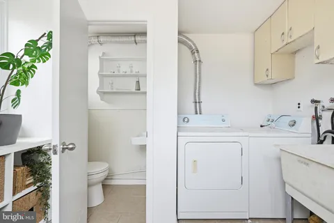 a bathroom with a sink a toilet and vanity