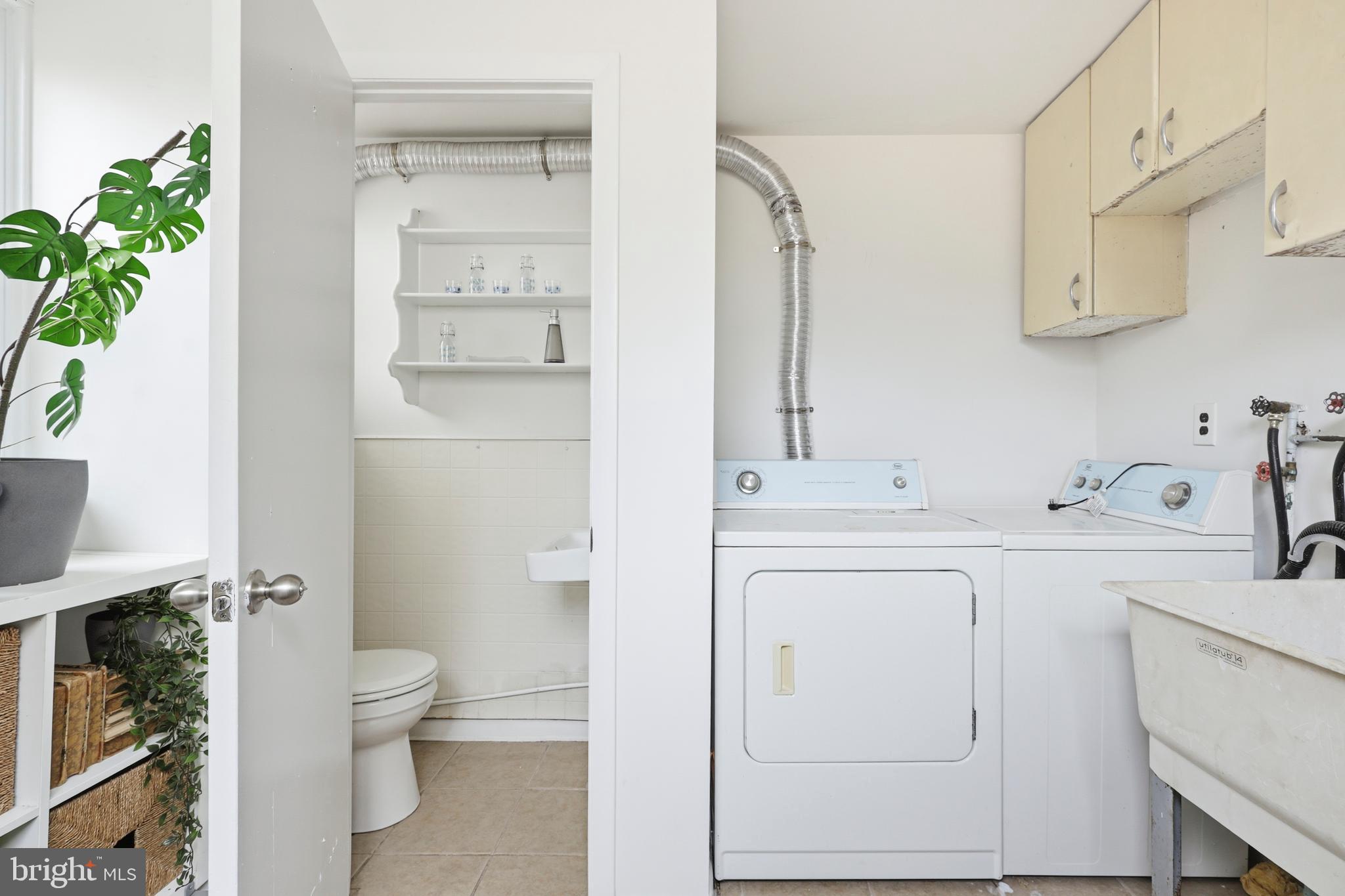116 West Duval Street Philadelphia, PA 19144 - Photo 13 of 28 a bathroom with a sink a toilet and vanity