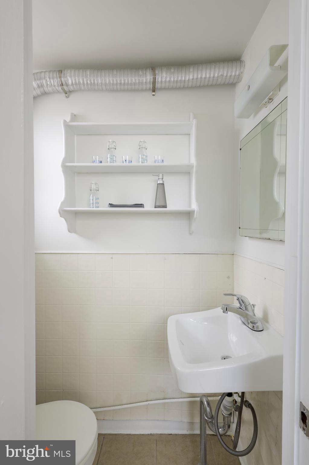 116 West Duval Street Philadelphia, PA 19144 - Photo 14 of 28 a bathroom with a toilet and a sink