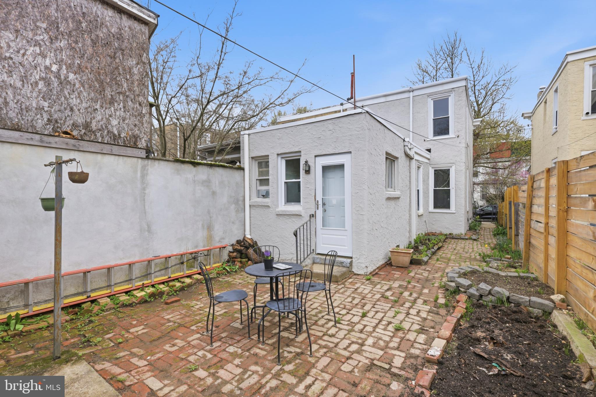 116 West Duval Street Philadelphia, PA 19144 - Photo 15 of 28 a backyard of a house with table and chairs