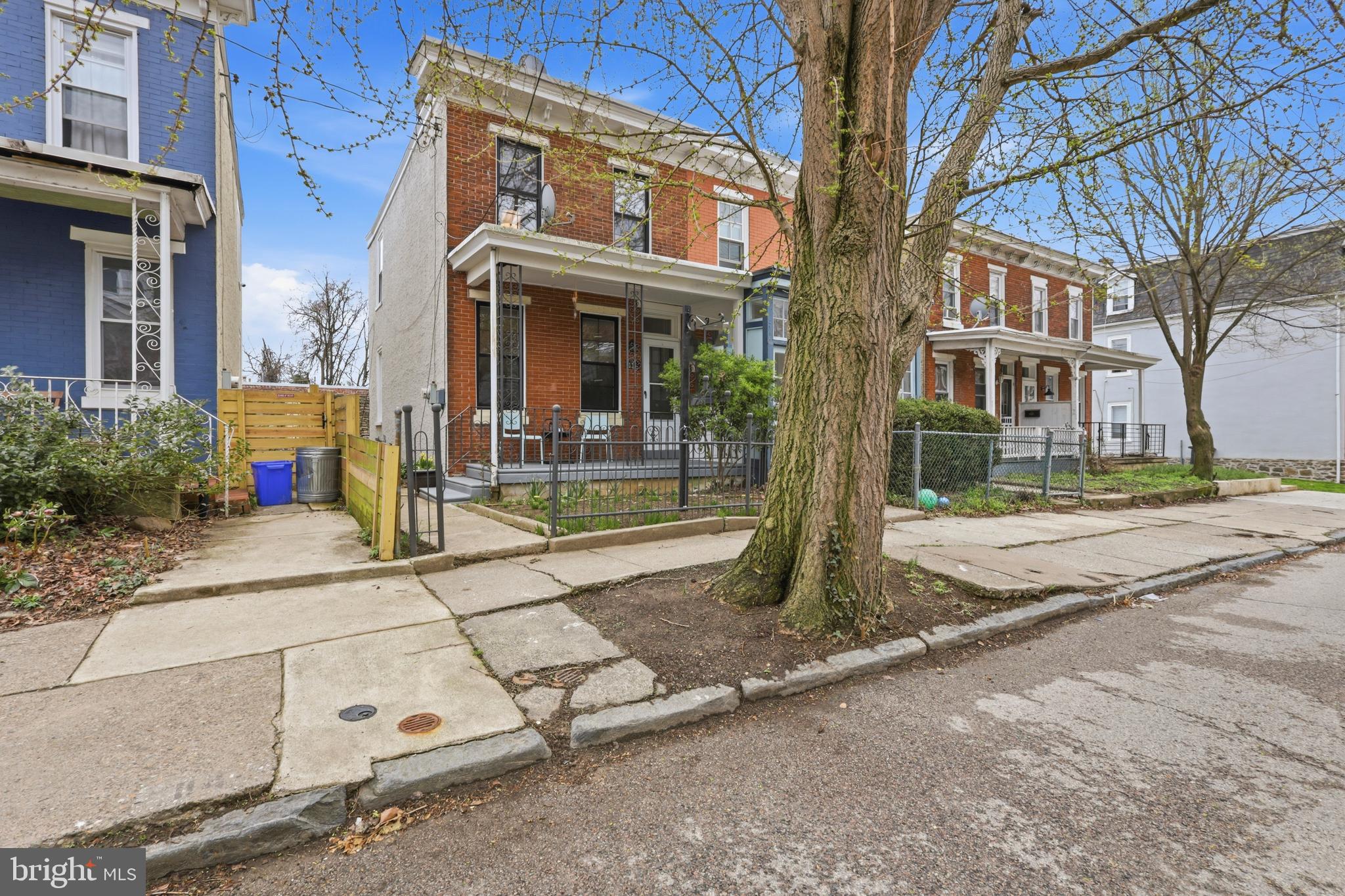 116 West Duval Street Philadelphia, PA 19144 - Photo 2 of 28 a view of a brick building with many windows