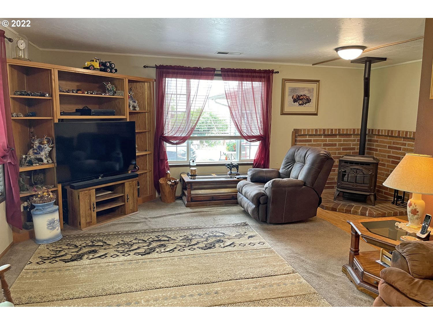91783 Marcola Road Springfield, OR 97478 - Photo 9 of 31 a living room with furniture and a flat screen tv