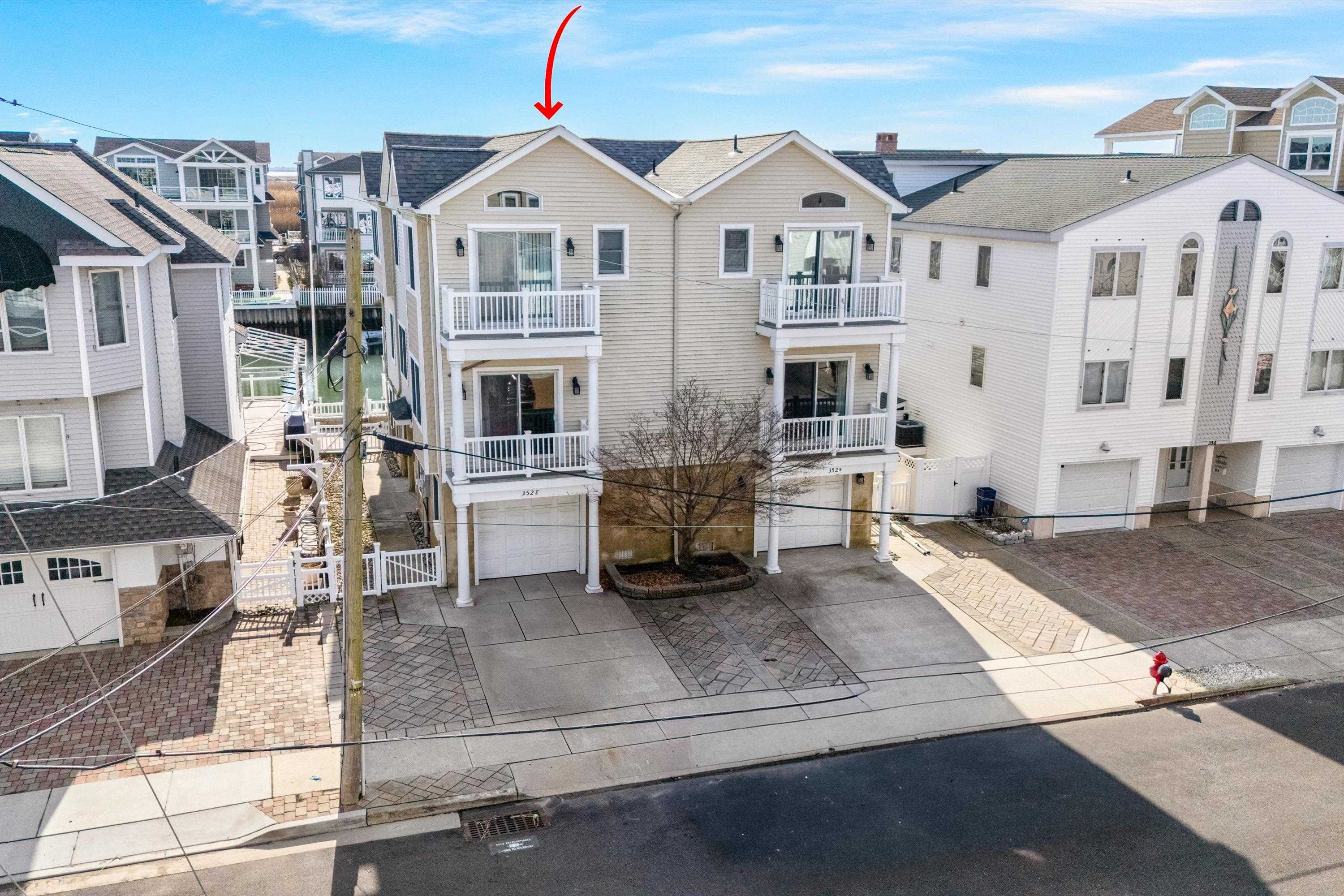 352 46th Place, Unit EAST Sea Isle City, NJ 08243 - Photo 1 of 40 a front view of multiple houses