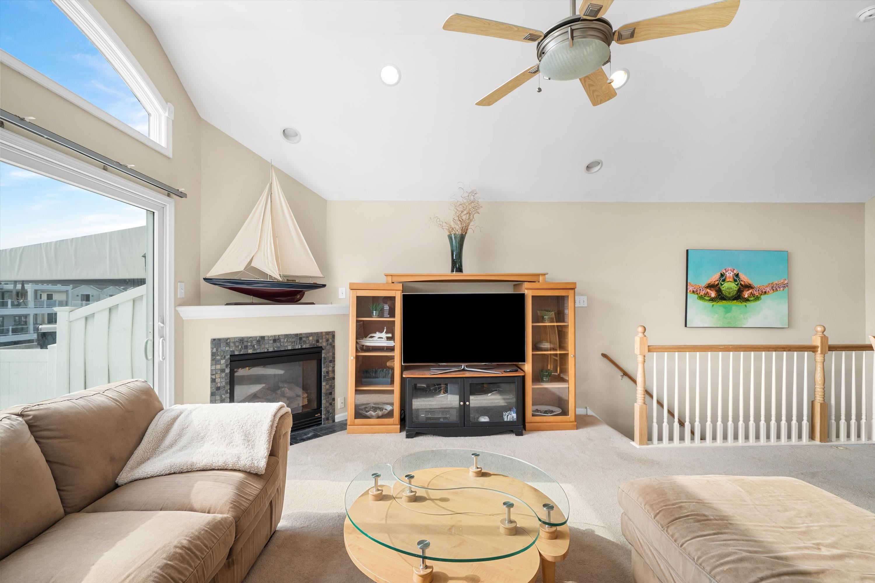 352 46th Place, Unit EAST Sea Isle City, NJ 08243 - Photo 13 of 40 a living room with furniture and a flat screen tv