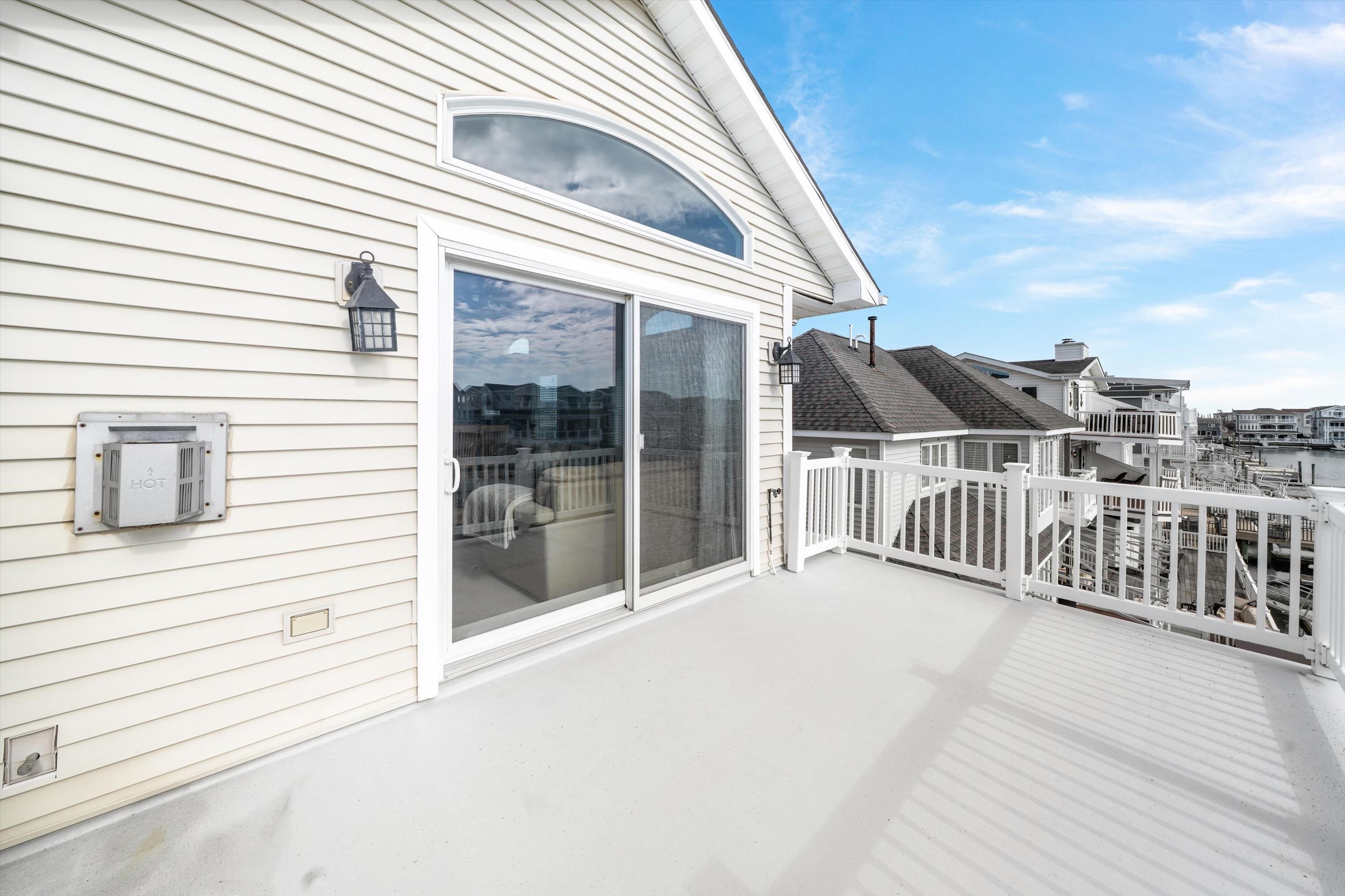 352 46th Place, Unit EAST Sea Isle City, NJ 08243 - Photo 19 of 40 a view of a house with a balcony