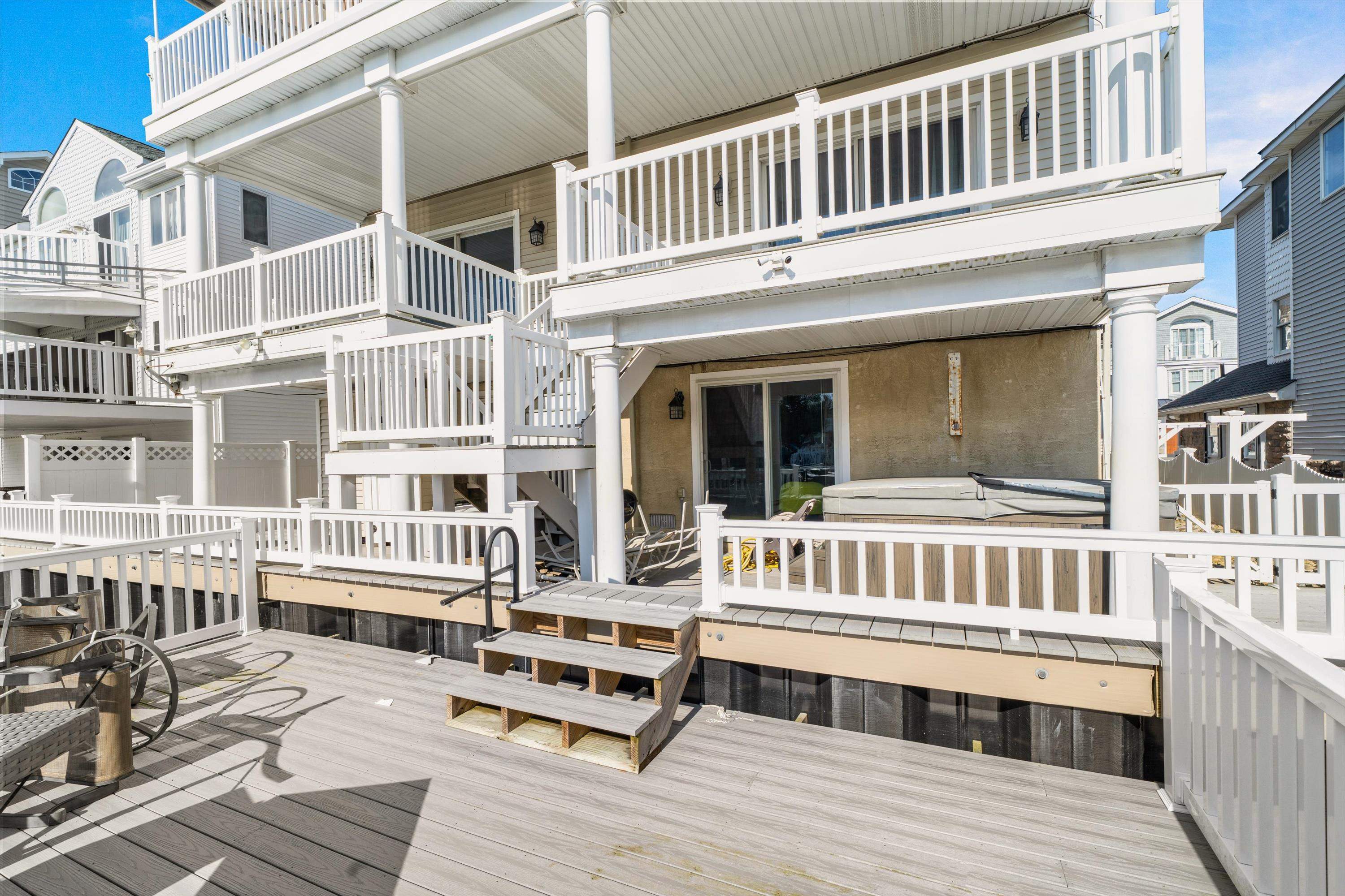 352 46th Place, Unit EAST Sea Isle City, NJ 08243 - Photo 3 of 40 a view of a building with a bench
