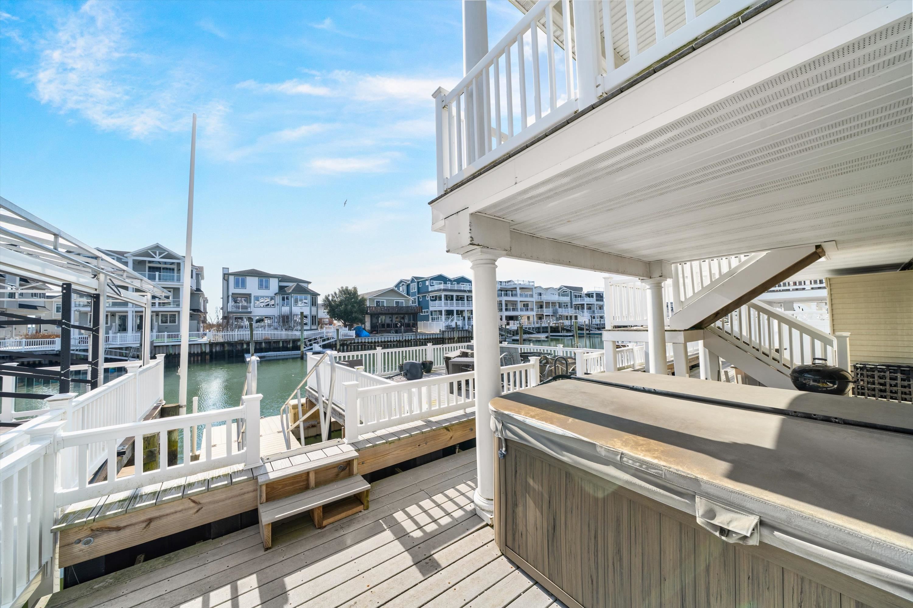 352 46th Place, Unit EAST Sea Isle City, NJ 08243 - Photo 31 of 40 a view of a balcony with couch and chairs