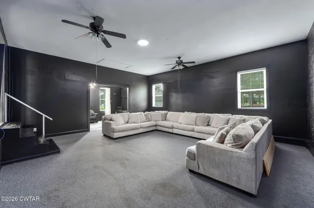 a bathroom with a sink vanity mirror and toilet