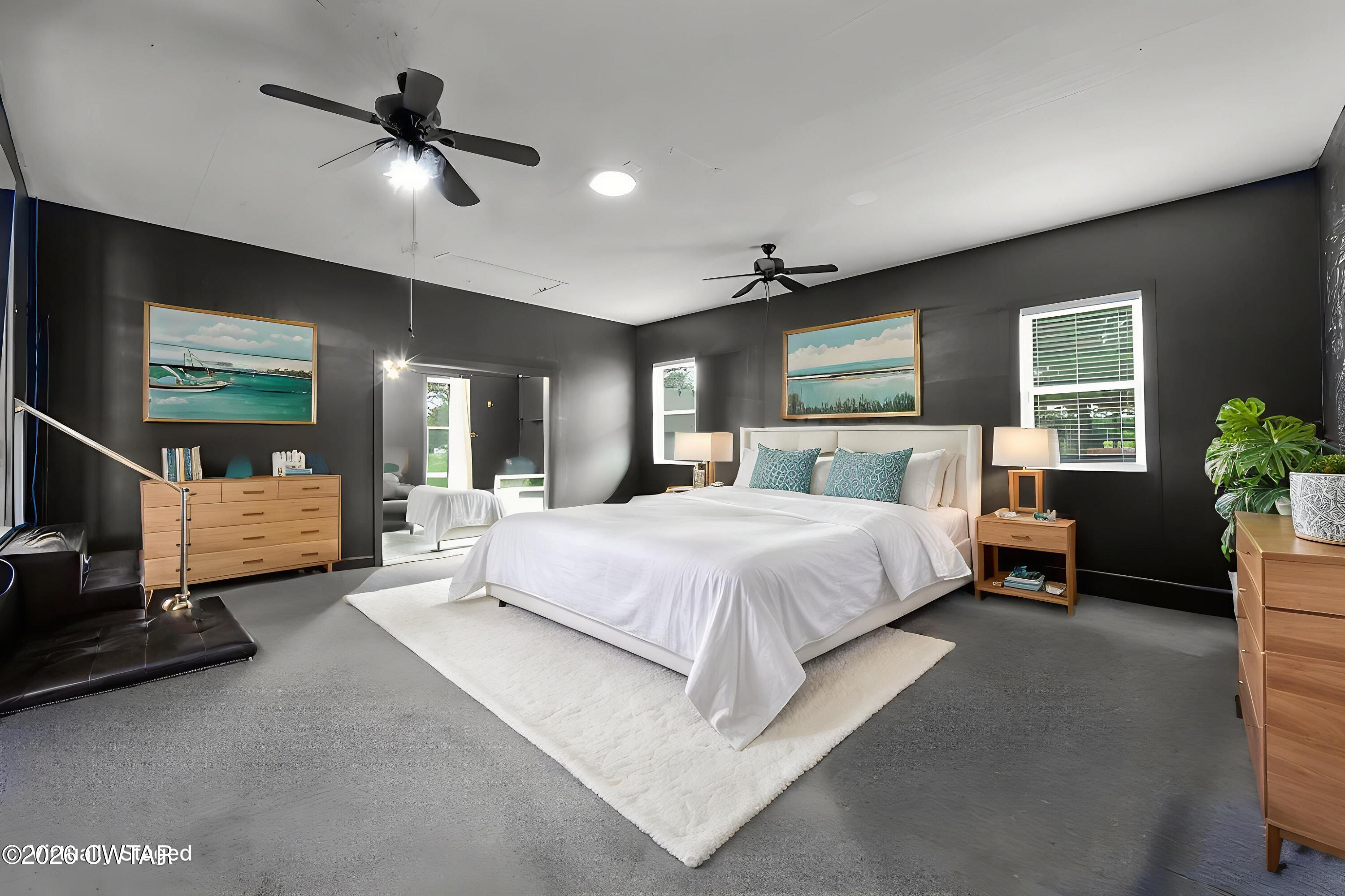 815 Trice Road Henderson, TN 38340 - Photo 13 of 34 a spacious bedroom with a bed and a chandelier