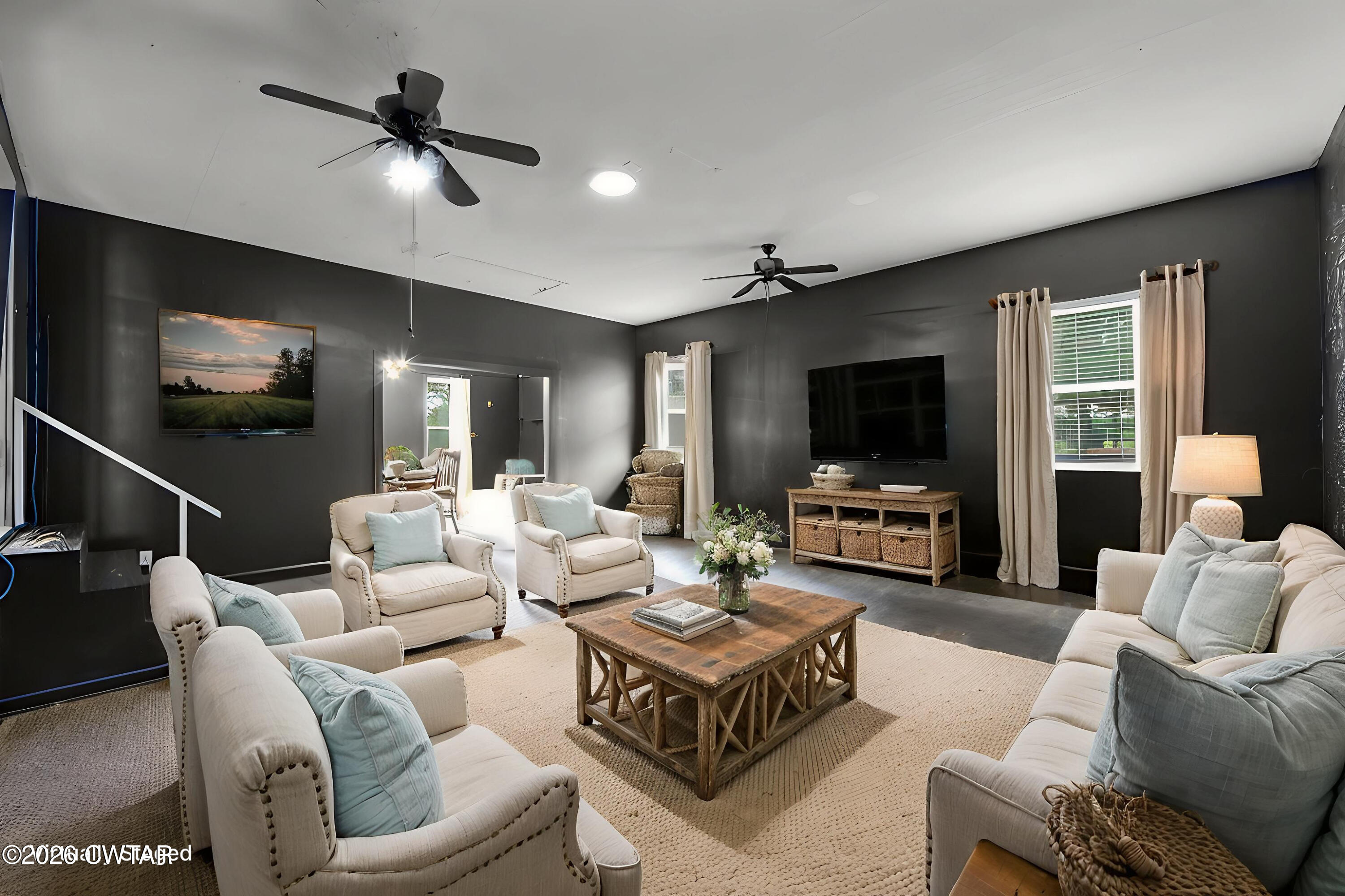 815 Trice Road Henderson, TN 38340 - Photo 14 of 34 a living room with furniture a flat screen tv and a large window