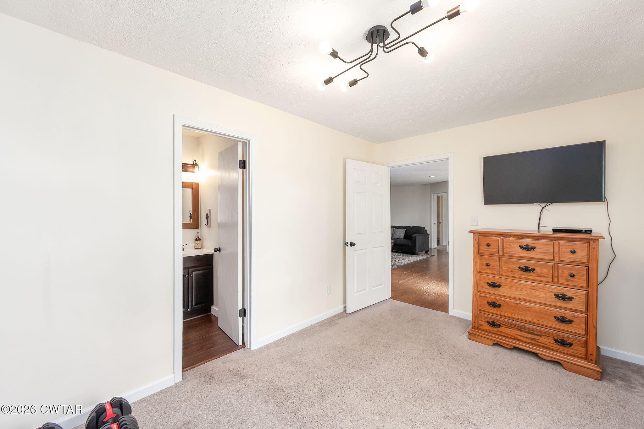 815 Trice Road Henderson, TN 38340 - Photo 19 of 34 a view of room with closet and flat screen tv