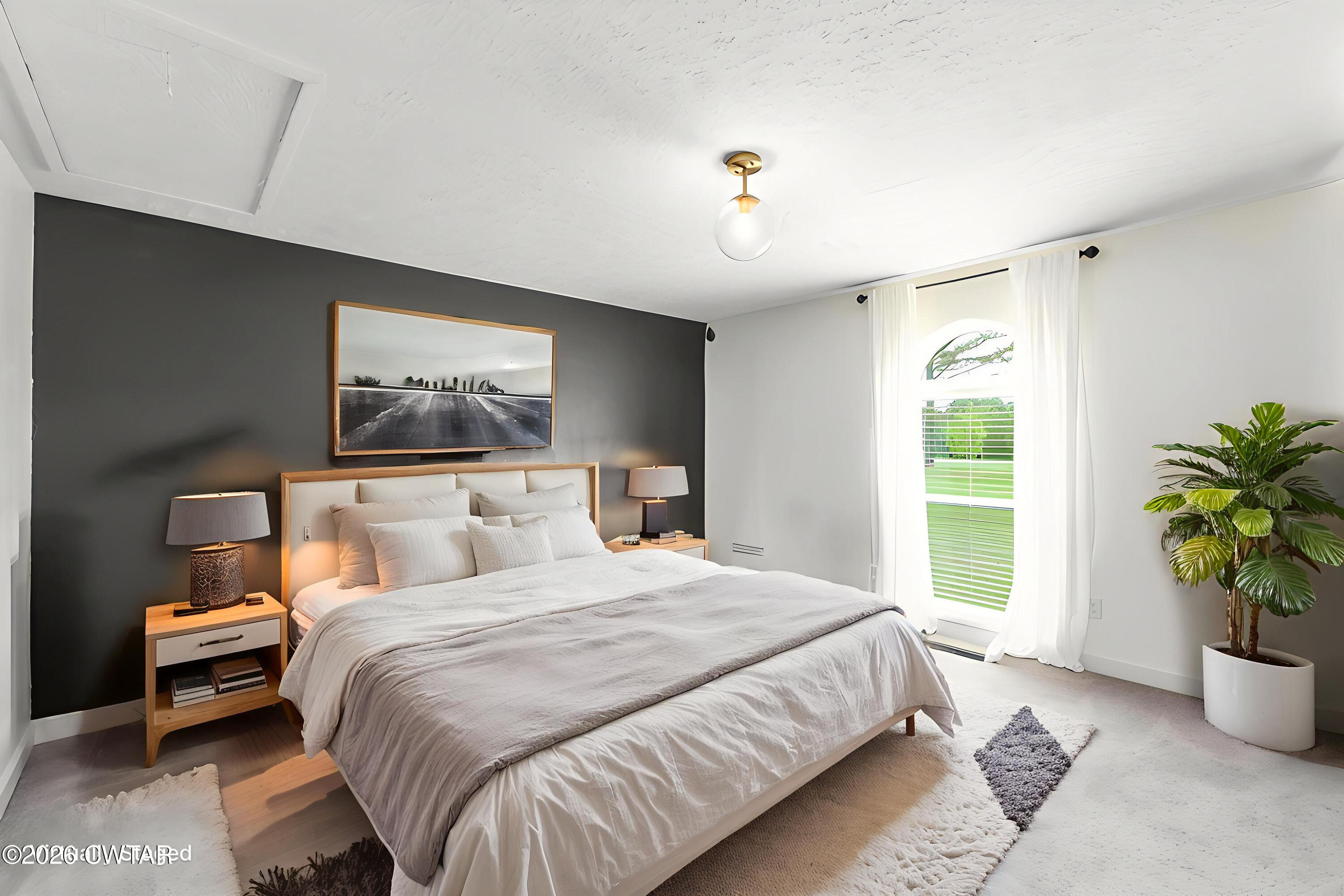 815 Trice Road Henderson, TN 38340 - Photo 22 of 34 a bedroom with a bed and a potted plant